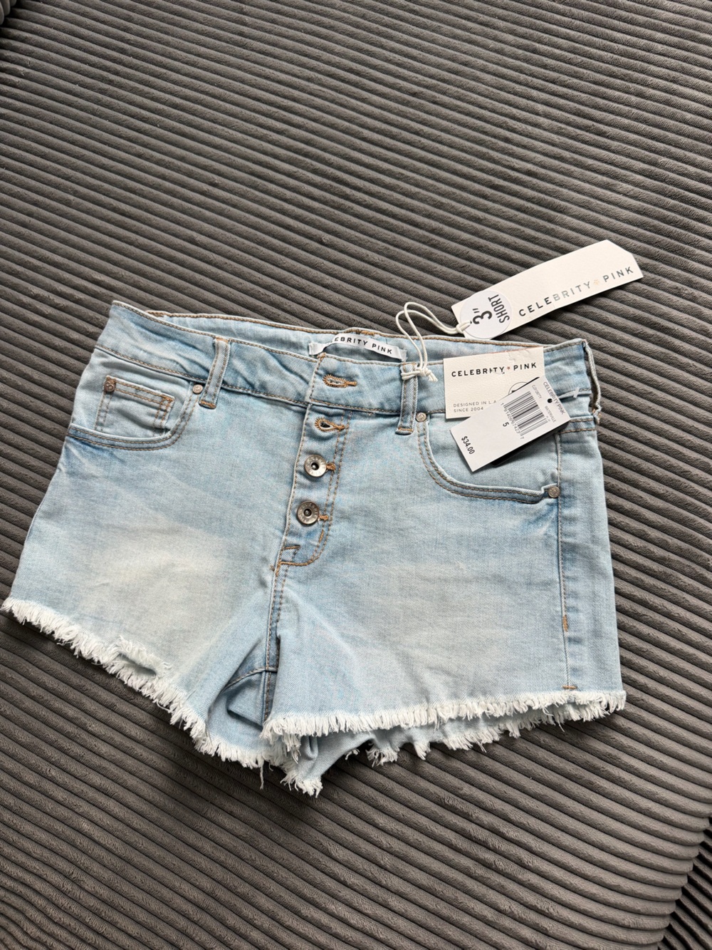 Celebrity Pink Light Wash Frayed Hem Denim Shorts